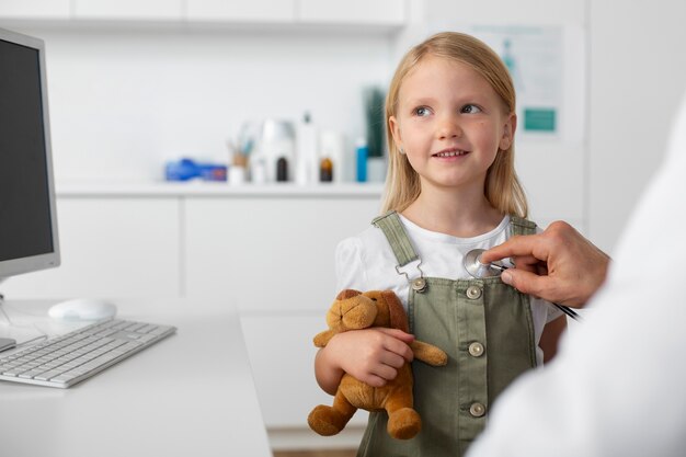 Young girl at the pediatrician for a consultation with her doctor