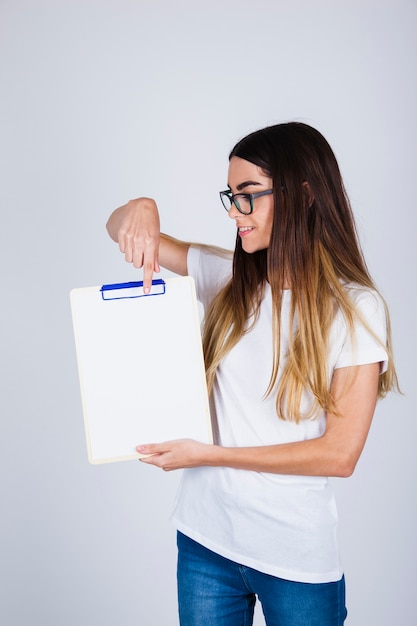 Young girl pointing a clipboard