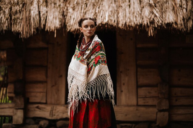 Young girl poses in Ukrainian dress