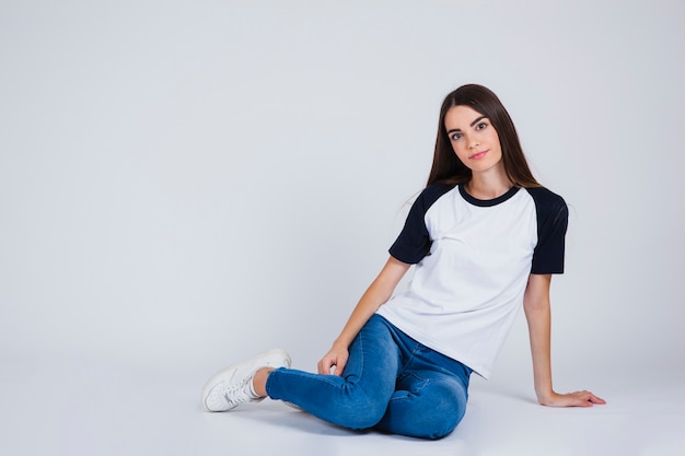 Young girl posing on the floor