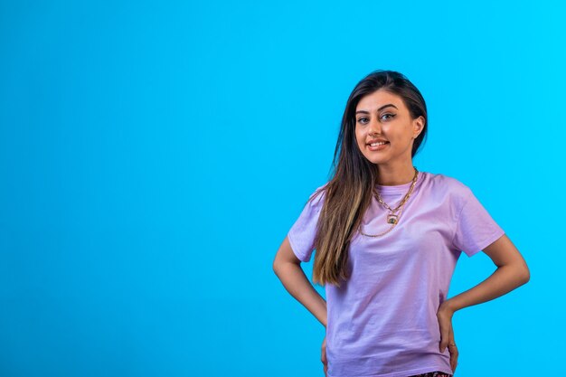 Young girl posing and smiling.