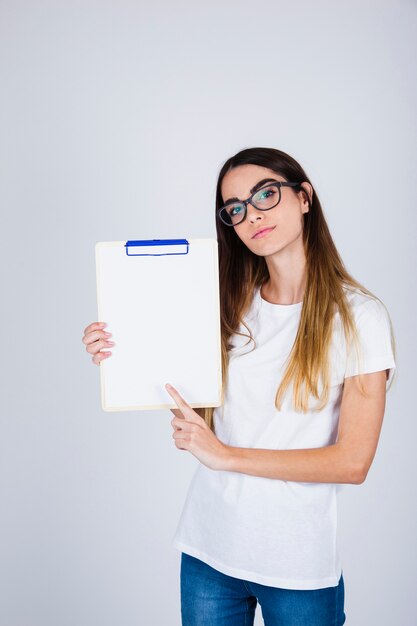 Young girl posing with a clipboard 