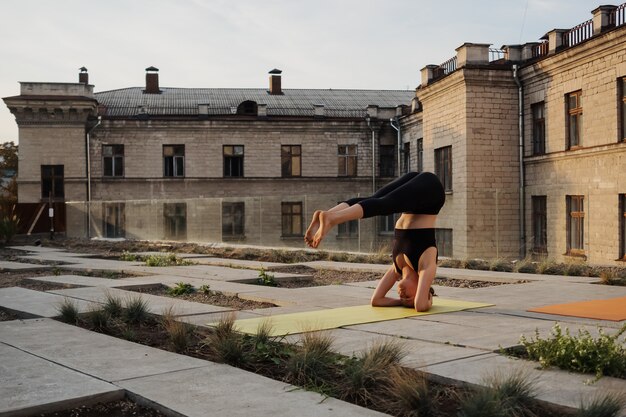 Young girl practicing stretching and yoga workout exercise