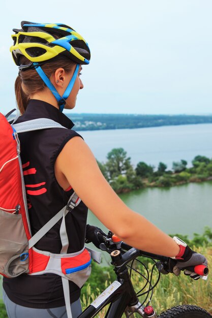 Young girl riding bicycle outside