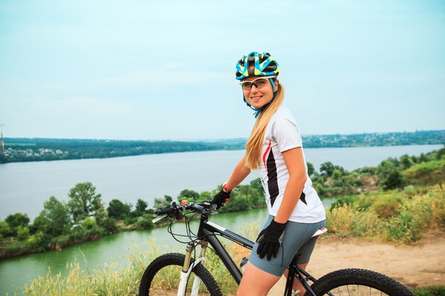 Young girl riding bicycle outside