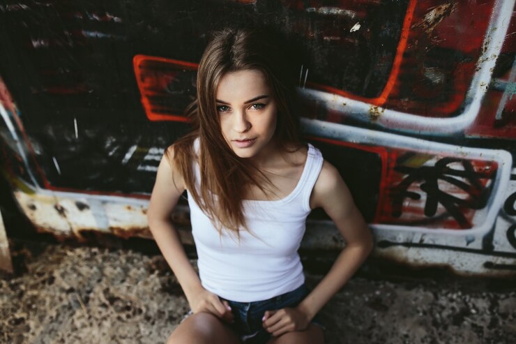Free Photo young girl seen from above while sitting on the floor