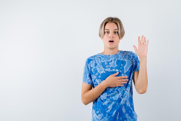 Young girl showing a stop hand gesture on white background