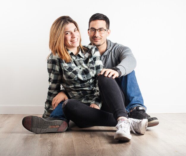 Free photo young girl sitting on top of her boyfriend