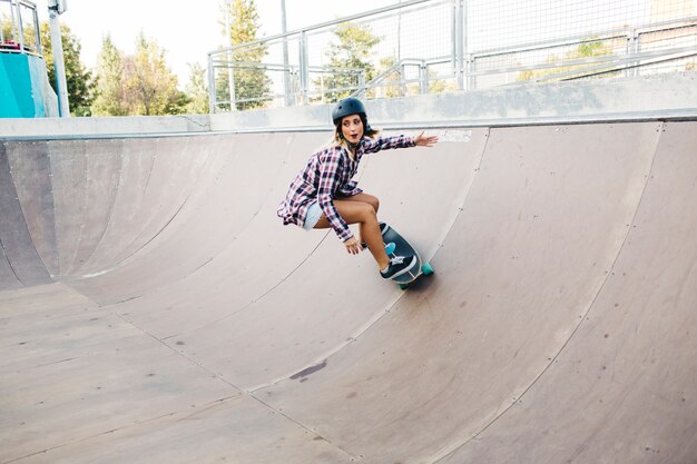 Young girl skateboarding with high speed