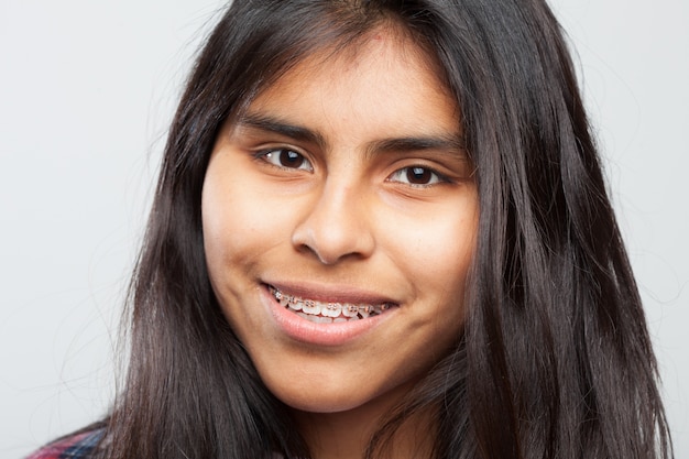 Free photo young girl smiling close up