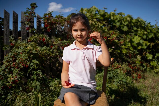 Young girl spending time outdoors in a rural area enjoying childhood