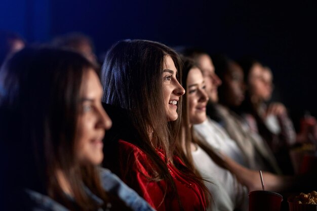 Young girl spending weekend in movie theater