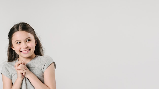 Young girl in standing in studio in foretaste