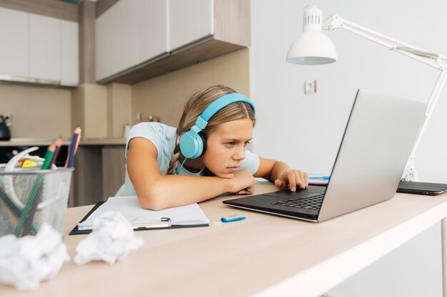 young girl studying at home