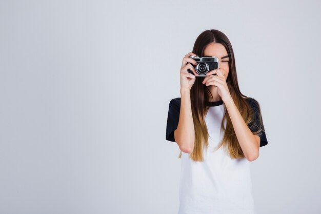 Young girl taking pictures