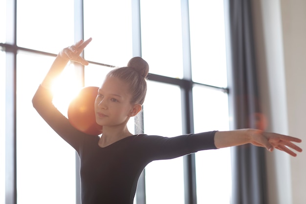 Young girl training in gymnastics