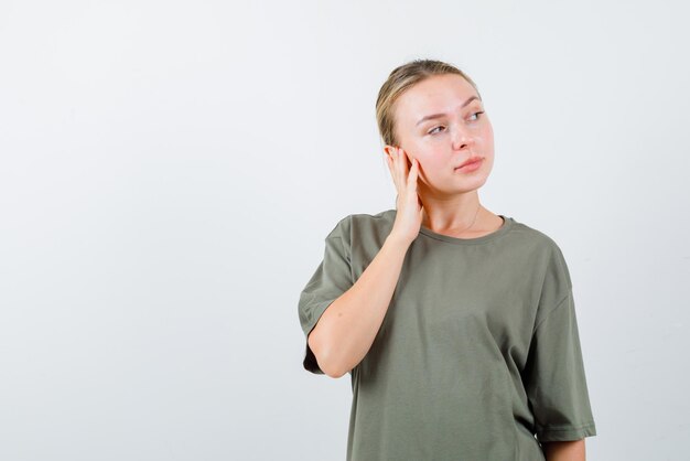 Young girl turning to the right on white background