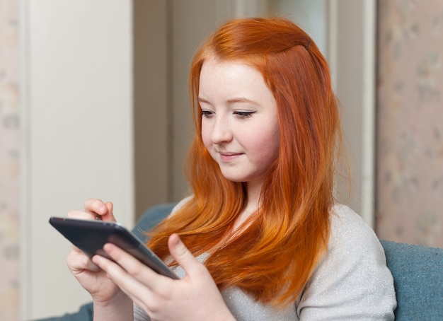 Young girl uses tablet computer