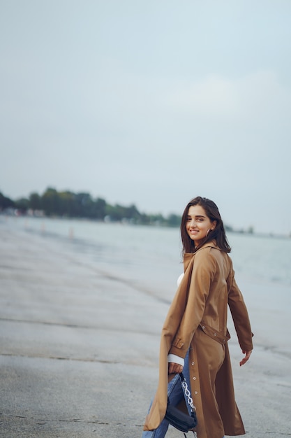 young girl walking on the beach