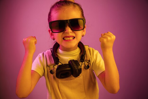 Young girl with headphones enjoying music