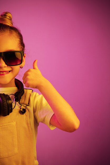 Young girl with headphones enjoying music