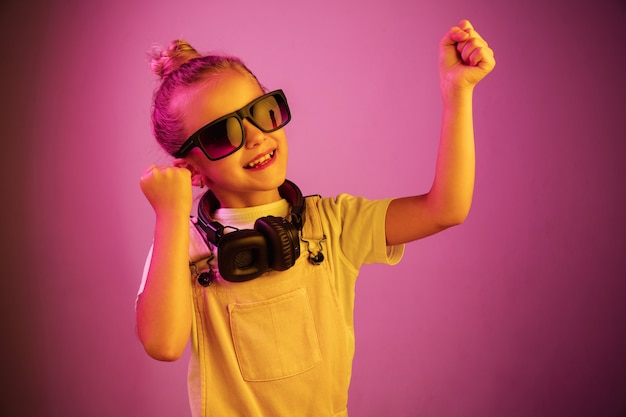 Young girl with headphones enjoying music