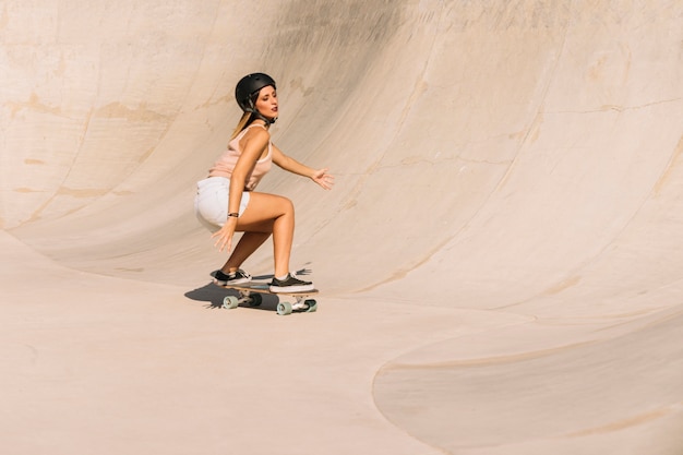 Free photo young girl with helmet skating