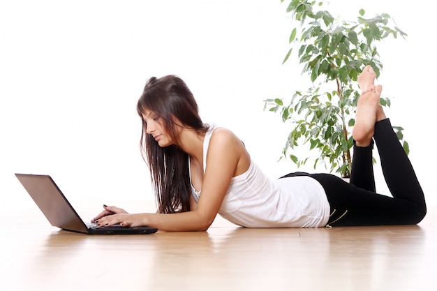 Young girl with laptop at home