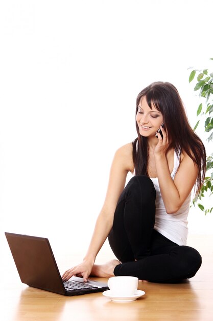 Young girl with laptop at home