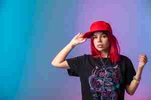 Free photo young girl with pink hairs wearing a red cap.