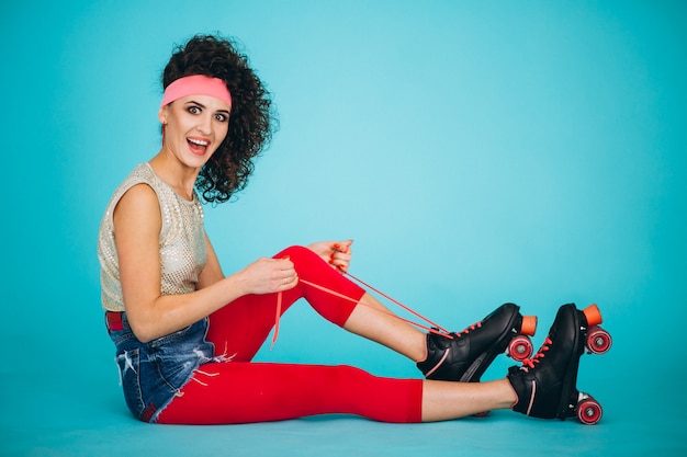 Free photo young girl with roller skates isolated