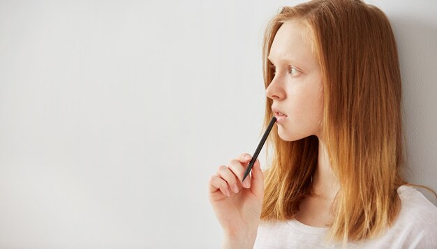 Young girl writing into her notebook