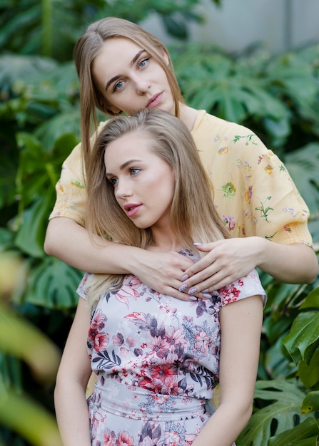 Young girlfriends posing together