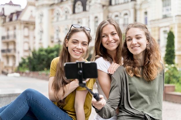 Young girlfriends taking selfie