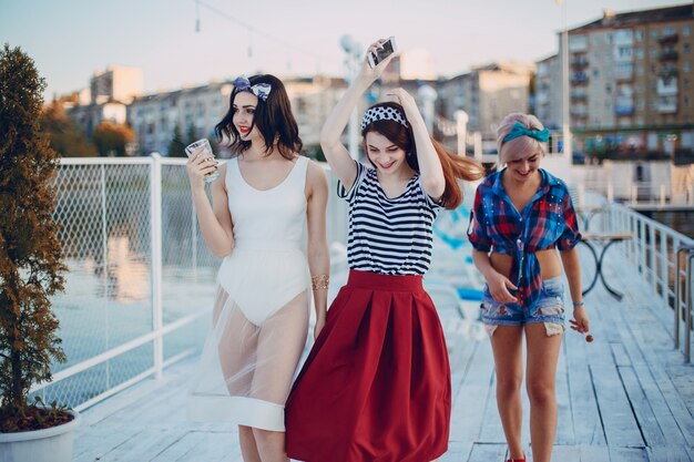 Young girls dressed in modern fashion walking