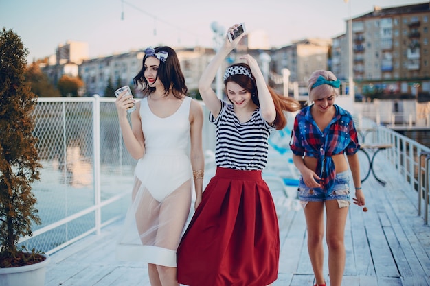 Young girls dressed in modern fashion walking