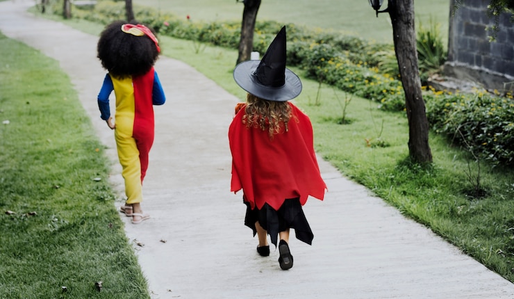 Free Photo young girls in halloween costumes