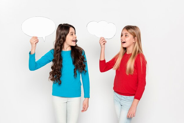 Young girls holding bubble chat