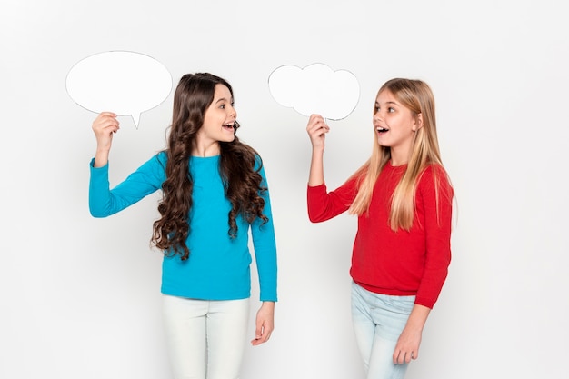 Young girls holding bubble chat