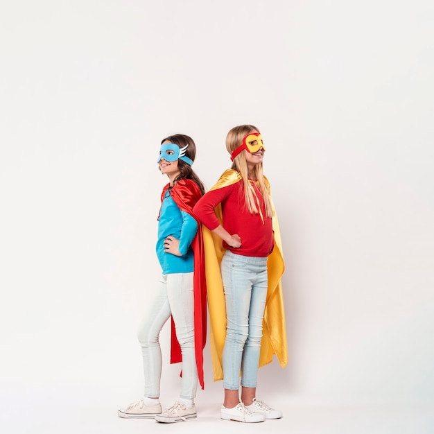 Young girls wearing superhero costume