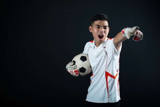 Free photo young goalkeeper soccer man isolated of academy soccer team