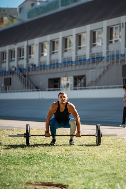 Young guy raises the bar in the stadium