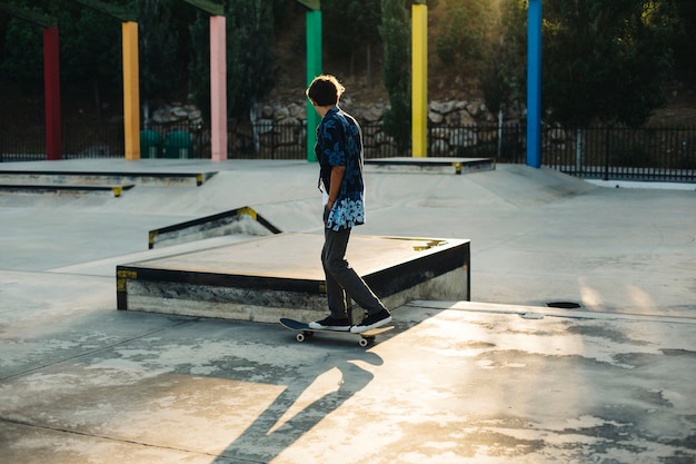 Young guy, skateboard and skatepark