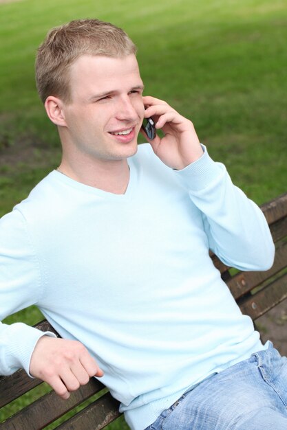 Young guy talking by cellphone