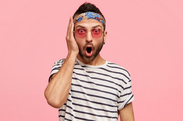 Young guy wearing bandana and stylish sunglasses