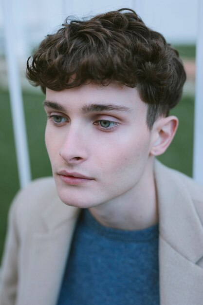 Young guy with coat gazing 