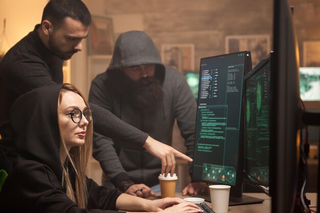 Young hacker working together with cyber terrorists to break down governments