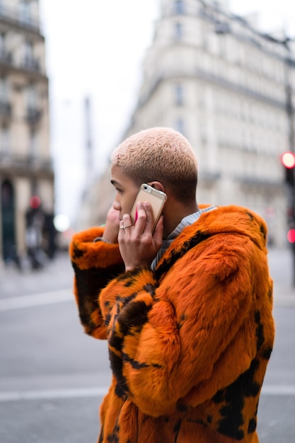 young handsome african american man on the street talking on a smartphone.