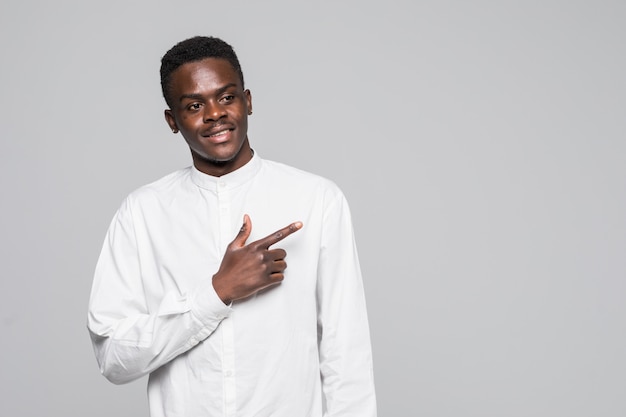 Young handsome African man against white background