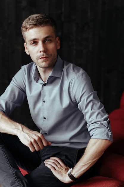 Young handsome businessman posing indoor